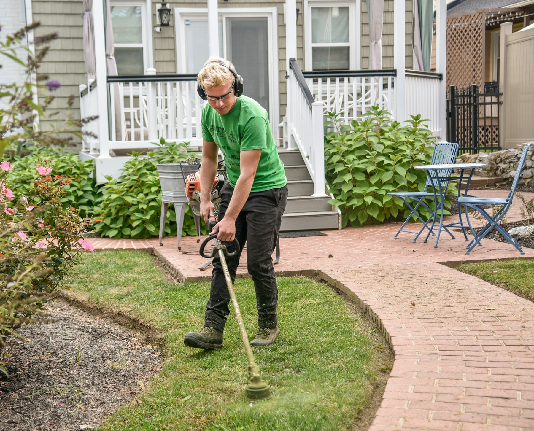 A landscaper at work in a garden.