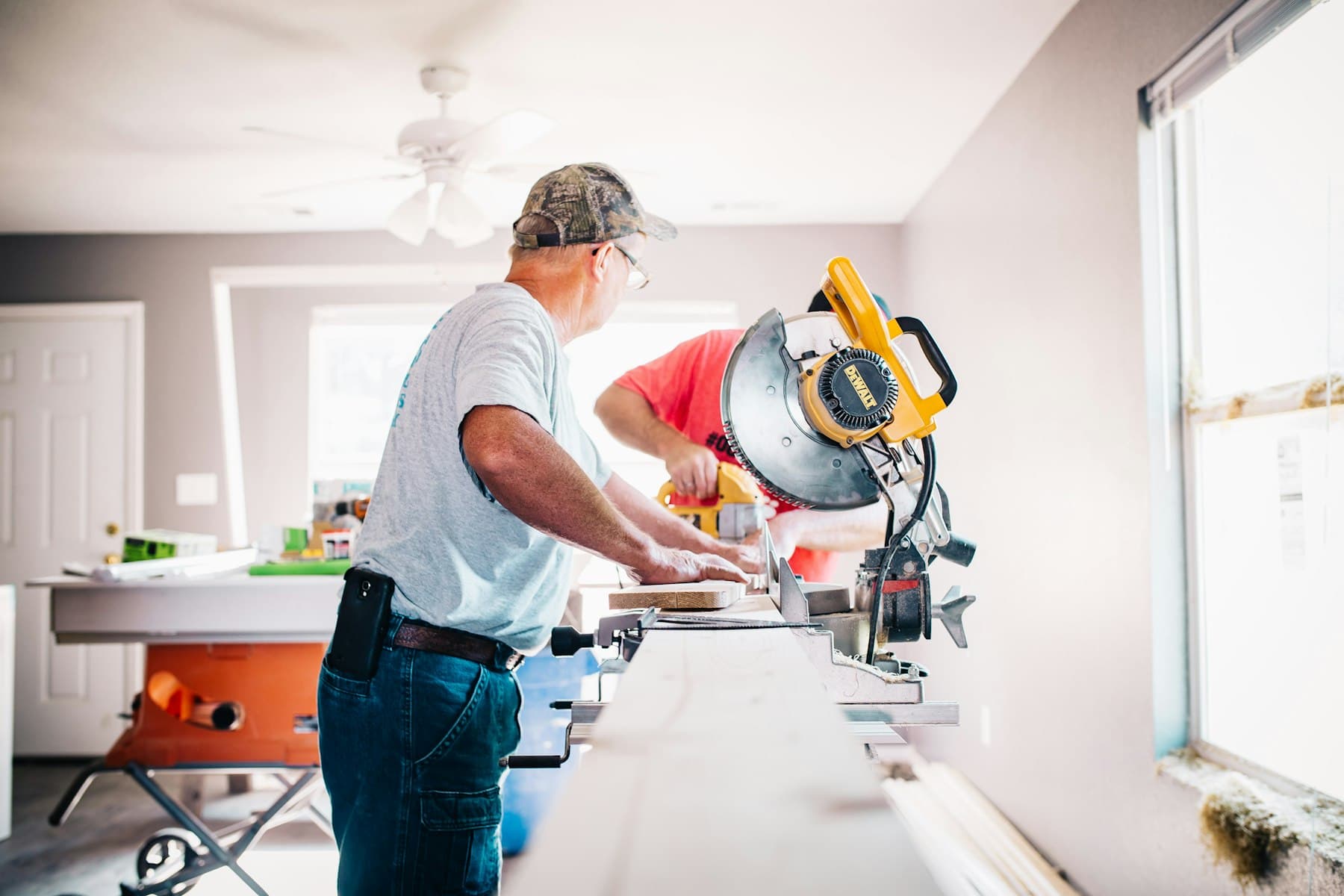 A handyman working with tools on a home repair.